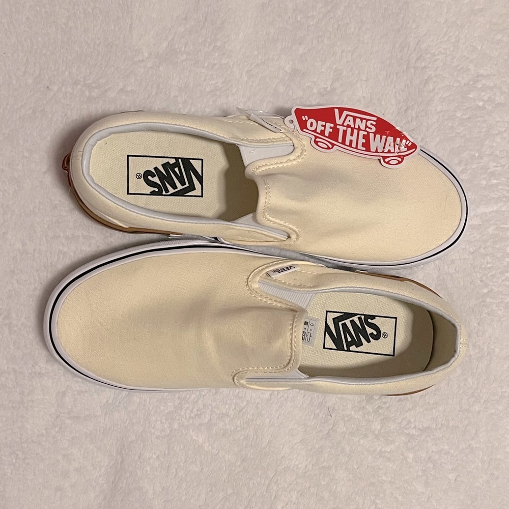 Cream slip on vans